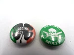 Two Flogging Molly 1-INCH Pins, Shamrock And Skull & Cross Bones. Fixed Price $5.99.