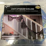82589 Lighted Garland Black Gauze With 35 Purple Mini Lights. Fixed Price $16.57.