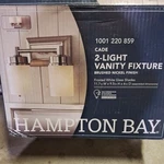 Hampton Bay Cade 2-LIGHT Brushed Nickel Vanity With Frosted Glass Shades. Fixed Price $40.00.